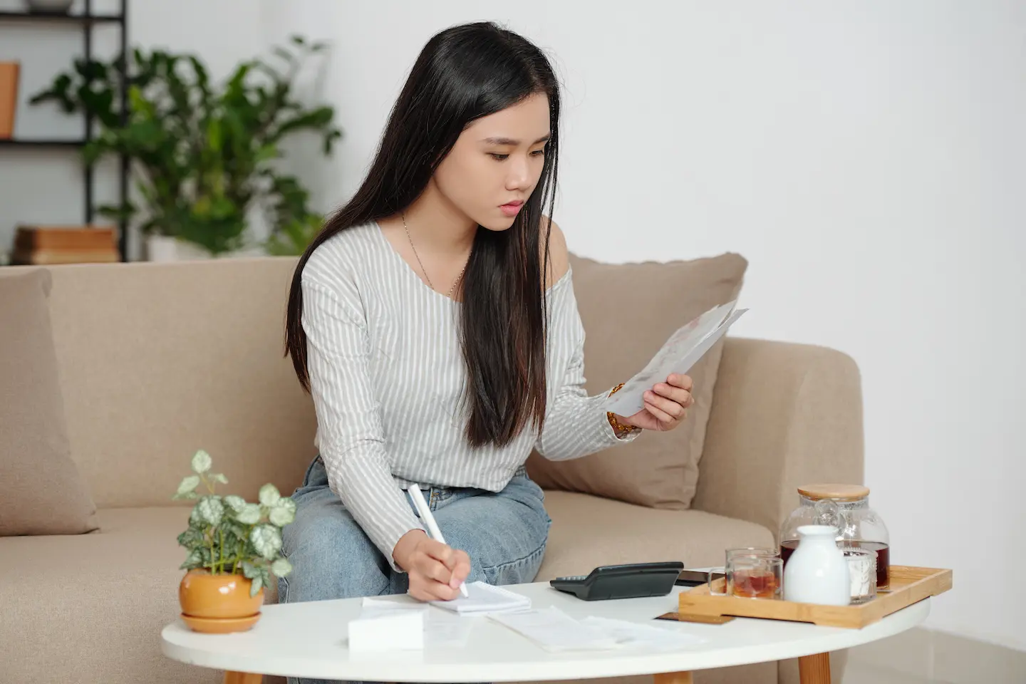 Woman calculating rent payments